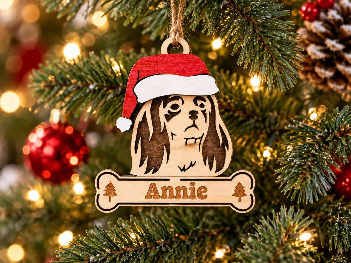 Cavalier King Charles Spaniel Santa dog ornament on tree